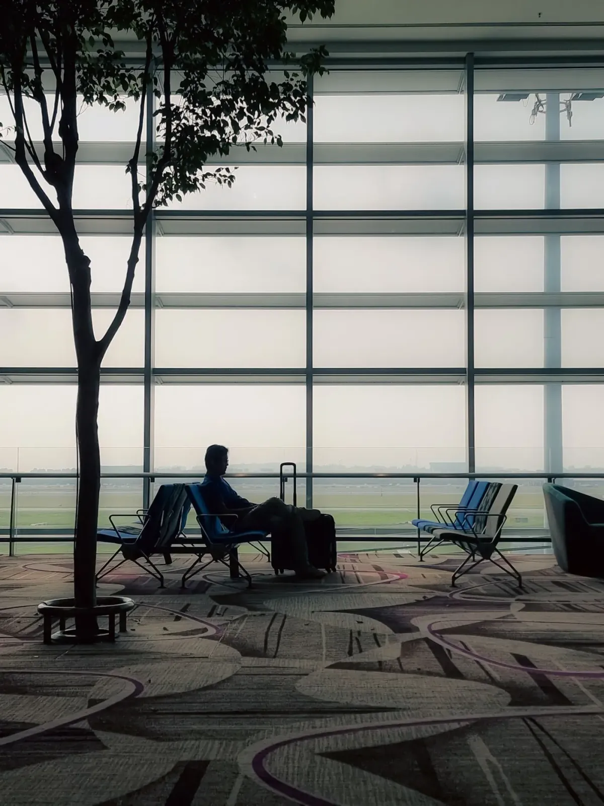 Traveler with a suitcase at the airport